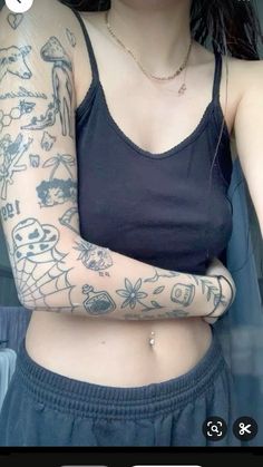 a woman with tattoos on her arm and arms