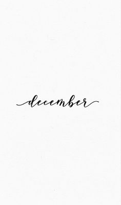 a black and white photo with the word december written in cursive writing on it