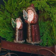 an old fashioned christmas sleigh with two santas