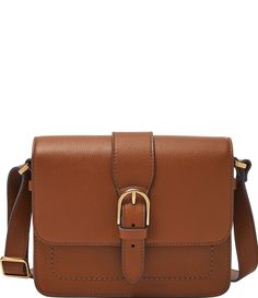 From Fossil&#x2C; the Zoey Medium Flap Crossbody Bag features: Exterior material: leather/polyurethane trim Interior material: 100% cottonGold-tone hardwareFlap&#x2C; hidden magnetic closureExterior: 1 back slide pocketInterior: 1 Slide Pocket&#x2C; 1 Zipper Pocket1 Adjustable Crossbody StrapApprox.: 7.75" L x 2.25" W x 6.25" H; 23.5'' shoulder dropImported. Fossil Bag, Leather Saddle Bags, Brown Shoulder Bag, Fossil Bags, Christmas 2024, Dillard's, Medium Bags, Arm Candy, Zipper Bags