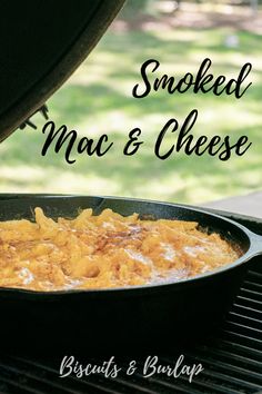 a skillet with macaroni and cheese cooking on the grill