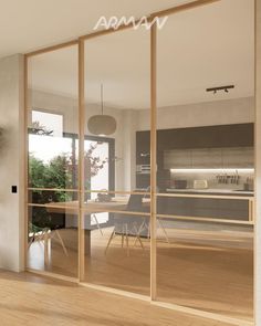 an open kitchen and dining room with sliding glass doors