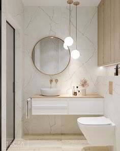 a bathroom with a toilet, sink and round mirror above the bathtub is shown