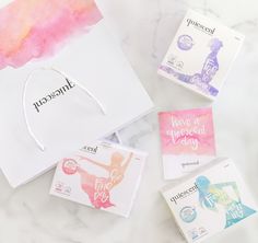 three different types of paper goods on top of a marble surface with the word anecoray printed on them