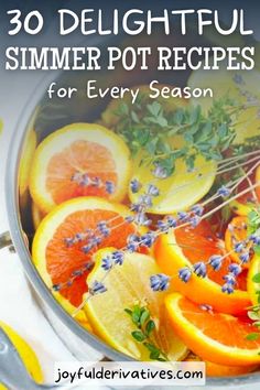 a pot filled with lemons, oranges and lavender on top of a table