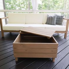 a couch and coffee table on a deck