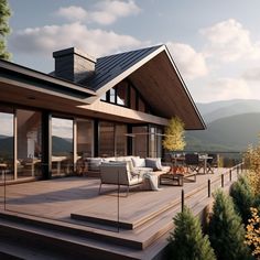 a large deck with chairs and tables on it next to a house in the mountains