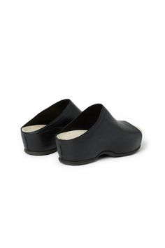 The inaugural Rosetta Getty x ECCO collection features four modern interpretations of the classic Scandinavian clog. Each style  including this sleek open-toe clog  is crafted from a supple, more sustainable form of leather that has been developed using ECCOs revolutionary DriTan process, which uses significantly less water to tan leather.  Color: Black  Fabric: DriTan calf leather  Made in: Denmark Fit: Runs small. Customers are advised to take the next size up.   A percentage of proceeds raise Elegant Black Open Toe Clogs, Leather Lined Open Toe Clogs, Black Leather Open Toe Clogs, Non-slip Open Toe Synthetic Clogs, Open Toe Clogs With Leather Footbed, Medium Width, Rosetta Getty, Leather Mules, Dansko Professional Clog, Mule Clogs