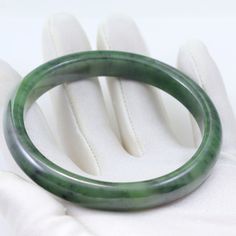 Your choice of a thick or narrow natural nephrite jade bangle bracelet. The inside dimension is 7 3/4". Optional widths are 3/4" or 3/8". Nephrite Green Jade is a strong stone and perfect for a bangle. Carries all the metaphysical properties of jade. Jade Bangle Bracelet, Jade Bangle, Nephrite Jade, Green Jade, Jade Green, Bangle Bracelet, Bangle Bracelets, Jade, Bangles