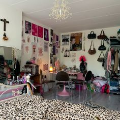 a room filled with lots of clutter and furniture next to a chandelier