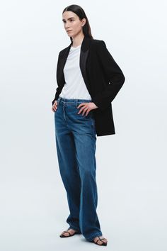 Experience a new level of comfort and style with our cotton-tencel blend flat front pants. We've taken denim to the next level by infusing it with tencel, a fabric renowned for its exceptional softness and breathability. The fabric's softness is unmatched - similar to sweats but with an elevated trouser-like silhouette. What sets these pants apart is their thoughtful design. Instead of the traditional five-pocket jean style, we've added unique pant details that exude sophistication and elevate y Tailored Spring Casual Jeans, Spring Casual Tailored Jeans, Tailored Casual Jeans For Spring, Casual Tailored Jeans For Spring, Relaxed Fit Denim Pants For Business Casual, Elegant Straight Leg Jeans With Pockets, Business Casual Full Length Jeans For Spring, Denim Blue Jeans For Workwear With Straight Hem, Modern Jeans With Welt Pockets For Work