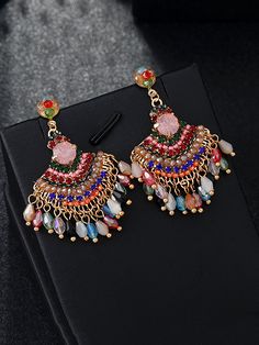 Add a touch of vintage charm to any outfit with these Women Vintage Crystal Tassel Fan Shape Earrings. Adorned with sparkling crystals, these elegant earrings will catch the light and draw attention to your face. Perfect for a night out or a special occasion, these earrings will elevate your style. Item Code: 7657861709886 Material: Bead.Alloy Pattern: Tassel Highlight: Plated Party. Daily.Vacation Gift.Traveling Slides Women, Red Blue Green, Dress Jewelry, Boho Stil, Sparkling Crystal, Vintage Crystal, Women Vintage, Elegant Earrings, Green And Orange