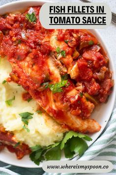 fish fillets in tomato sauce on top of mashed potatoes