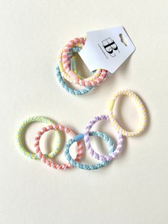 Sorbet Pastels // Braided Hair Tie Set Traditional hair ties with a twist. Soft neon shades perfect for spring and summer.  Love the colors in this set of 5!  Imported. Bracelet Hair Tie, Soft Neon, Hair Tie Bracelet, Set Bracelet, Best Bow, Braided Hair, Summer Love, Tie Set, Natural Silk