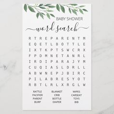 the baby shower word search game is shown on a marble surface with white and green leaves