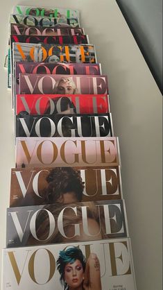 several magazines stacked on top of each other