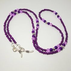 Keep your glasses or your mask close by with this Pretty Beaded Chain. It is a perfect way to brighten up any outfit.  It measures approx. 32 inches. It is made with shades of purple beads with antique silver beads.  You can choose white rubber eyeglass holders for glasses and sunglasses, silver lobster clasps for holding masks, or both to be able to use either way.  It is made with 49 strand jewelry wire for maximum durability, but the 4mm beads make it a very lightweight lanyard. All of my ite Lavender Mask, Eyeglasses Chains, Beaded Eyeglass Chain, Chain Sunglasses, Teacher Office, Sunglasses Silver, Sunglasses Chain, Sunglasses Strap, Beaded Lanyard