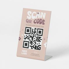 the scan or code book is displayed on a white surface with pink and black designs