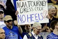 a group of people holding signs in the stands