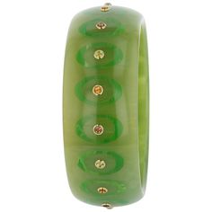 This bangle, from the Mark Davis Collector Line, is made of moss green marbled vintage bakelite. It has been precisely inlaid with tonal green ovals that are open in the center. The center of each ellipse features a brilliant citrine, peridot or smoky quartz. All stones have been bezel-set in 18k yellow gold. This is an extremely elegant and versatile piece. Metal 18-Karat Yellow Gold (Au750) Gemstones Citrine 0.58 ctwPeridot 0.77 ctwSmoky Quartz 0.58 ctw Dimensions Inner Diameter 66.00 mm (2.60 Bakelite Bangles, Green Oval, Vintage Bakelite, Moss Green, Smoky Quartz, Bezel Setting, Gift Necklace, Citrine, Ring Earrings