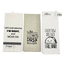 three hand towels with different sayings on them, one in white and the other in black