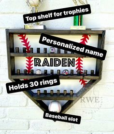 a baseball bat shaped shelf with personalized name tags