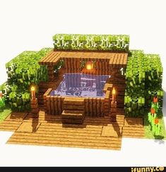 an outdoor hot tub surrounded by plants and candles