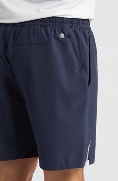 Keep your valuables protected while running errands or around the track in these elastic-waist shorts made from a lightweight, stretch-enhanced fabric. A secure hidden-zip pocket is perfect for stashing a key or other important essentials. 7" inseam; 22 1/2" leg opening; 11 1/2" front rise; 15 1/2" back rise (size Medium) Elastic waist Front slant pockets; hidden side-zip pocket Reflective logo enhances visibility in low light or at night 89% polyester, 11% spandex Machine wash, tumble dry Impor 4-way Stretch Athletic Shorts With Pockets, Breathable Micro-elastic Athletic Shorts For Running, Functional Running Athletic Shorts 5-inch Inseam, Sports Shorts With Pockets And 5-inch Inseam, Sportswear Shorts With Pockets And 4-way Stretch, Elastic Waist Shorts, Running Errands, Elastic Waist, Zip Pockets