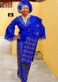 This beautiful dress is handmade with quality African aso oke/lace * It is fully lined *it is designed with stones * It is suitable for any occasion. It takes 5-7 business days to produce and 3-5 business days to deliver. Shipping is done through DHL express. Sizing: Kindly check our size chart to guide you in selecting a size that fits you best. You can also send the following measurements in order to ensure a perfect fit: Shoulder to shoulder Shoulder to waist Shoulder to hem(dress length) Bus Elegant Gown With Traditional Patterns For Ceremonies, Elegant Wedding Gown With Traditional Patterns, Elegant Fitted Gown With Traditional Patterns, Elegant Formal Dresses With Traditional Patterns, Elegant Embellished Traditional Wear For Ceremonies, Elegant Floor-length Formal Traditional Wear, Party Dress With Lace Work And Traditional Drape, Elegant Evening Sets With Lace Work, Elegant Wedding Sets With Traditional Patterns