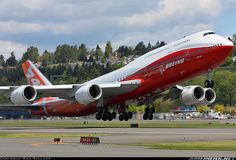 an airplane taking off from the runway at an airport with it's landing gear down