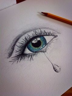 a pencil drawing of an eye with tears