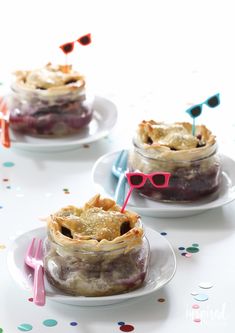 three small pies with glasses on them