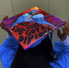 a woman wearing a graduation cap that says she got a diploma