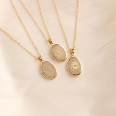 Personalized Oval Locket Necklace Set, Vintage Locket Necklace, Custom Photo Pendant, Keepsake Jewelry, Christmas Gift, Gift for Her 🌟Color: gold 🌟Length: 18+2'' 🌟Pendant size: 20 X16mm 🌈This elegant set of oval locket necklaces offers three distinct designs--sun, evil eye, and moon--allowing you to choose the symbol that resonates most with you. Each locket features a customizable photo compartment, making it a deeply personal and meaningful accessory. Perfect for personal use or as a thoughtful gift, these necklaces blend stylish engravings with the sentimentality of a cherished photo. Highlights: ✨Three Unique Designs Choose from three captivating designs: a radiant sun, a protective evil eye, or a serene moon. Each engraving is meticulously crafted to add a unique touch to your loc Oval Charm Necklace With Adjustable Chain As Gift, Oval Charm Necklaces With Adjustable Chain As Gift, Spiritual Oval Pendant Charm Necklaces As Gift, Spiritual Charm Necklaces With Oval Pendant For Gifts, Customizable Gold Locket Necklace For Gift, Adjustable Oval Necklace As Gift, Adjustable Oval Necklace Perfect For Gifts, Handmade Gold Locket Necklace Gift, Oval Charms Necklace For Gift