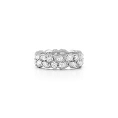 A smaller and more casual version of our Poppy Eternity Band, the Posey Eternity Band is a great way to upgrade your ringstack in a way that still feels wearable enough for the everyday. Handcrafted in 18-karat gold or platinum & featuring 1.90tcw of round, pear, and marquise-shaped diamonds. MATERIALS & MEASUREMENTS Handcrafted in 18-Karat Gold Available in Platinum Diamonds: 1.90 tcw Made in NYC STYLE JT2184R Carrie Necklace, Unique Diamond Wedding Bands, New York City Style, Gold Lariat Necklace, Nyc Style, Nameplate Necklace, Diamond Wedding Band