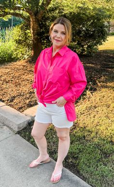 Get ready to Stand Up & Smile with this crisp collared button-down shirt in Raspberry pink! Made with 100% cotton, it features a flat pocket on the front, side slits, and endless style options. Layer it over a tank top or roll up the sleeves for a fun and versatile look. (Be prepared for compliments!) Features: Functional buttons down front. Cuffed sleeves- roll up or leave down Side slits for style and comfort Rounded hemline Fabric: 100% Cotton Brand: Double Zero Size Recommendation: S= Up to Pink Collared Shirt For Day Out, Pink Collared Top For Day Out, Chic Pink Tops With Pockets, Pink Shirt For Workwear In Summer, Solid Shirt With Shirttail Hem For Spring, Pink Summer Workwear Shirt, Spring Day Out Shirt With Pockets, Spring Shirt With Pockets For Day Out, Oversized Pink Shirt For Day Out