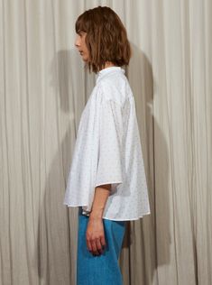 Effortless and relaxed gathered oversized shirt that slips on, made with an Italian cotton shirting fabric in a Fil Coupé dotted jacquard. We use the reverse side of the fabric that gives it a textured look but it is reversible to show a smoother look. Content: 100% Italian Cotton Model is 5'9" and wears a size S Made in NYC Also comes in BLUE Complimentary Shipping Worldwide Summer Daywear Shirt With Broderie Anglaise, Summer Broderie Anglaise Shirt For Daywear, Cotton Blouse With Broderie Anglaise In Relaxed Fit, Casual Broderie Anglaise Shirt For Daywear, White Relaxed Fit Blouse For Daywear, Summer Swiss Dot Tops For Daywear, Casual Swiss Dot Blouse For Daywear, Shirting Fabric, Popover Shirt