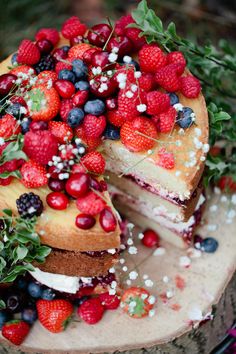 an image of a cake with berries and blueberries on the top is being viewed on instagram