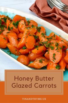 honey butter glazed carrots on a plate with a fork and napkin in the background