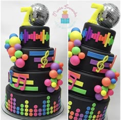 a multi - tiered cake decorated with musical notes and disco balls