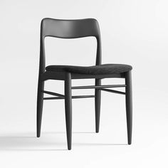 a black chair sitting on top of a white floor