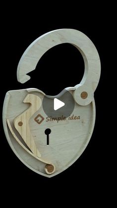 a wooden object with the words simple idea written on it and an open keyhole