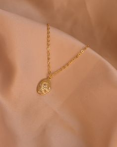 The Serena necklace is a detailed sturdy pendant with a minimalist star in the center. The Serena necklace depicts a beautiful design and captures the light in the sunshine. Beautiful piece to wear individually or layered! Chain 24K Gold Filled Rolo Chain Length: 17” inches Pendant: 24K Gold Filled 14mm x 11mm Gold Necklace With Flower Pendant Clavicle Chain, Gold Flower Pendant Choker Necklace, Gold Chain Necklace With Flower Pendant, Gold Flower Pendant Necklace Tarnish Resistant, Gold Tarnish Resistant Flower Pendant Necklace, Gold Tarnish-resistant Flower Pendant Necklace, Everyday Tarnish Resistant Flower Pendant Necklace, Everyday Tarnish-resistant Flower Pendant Necklace, Gold Star Necklace With Delicate Chain