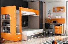 a bedroom with bunk beds and desks in the corner, orange accents on the walls