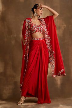 Buy Red Silk Crepe And Organza Embroidered Blossom Border Draped Skirt Set For Women by Niamh By Kriti Online at Aza Fashions. Asymmetric Cape, Indo Western Outfits For Women, Organza Cape, Haldi Outfits, Trendy Outfits Indian, Mehendi Outfits, Indian Bridal Lehenga, Traditional Indian Dress, Padded Blouse