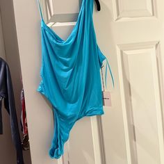 Such A Pretty Blue Chic Blue Bodysuit For Spring, Casual Blue Bodysuit For Loungewear, Chic Blue One-piece Bodysuit, Casual Blue Bodysuit For Night Out, Casual Blue Party Swimwear, Blue Bodysuit For Loungewear, Blue Summer Bodysuit For Parties, Blue Bodysuit For Summer Parties, Sleeveless Blue Bodysuit For Party