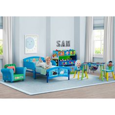 a child's bedroom with blue furniture and toys