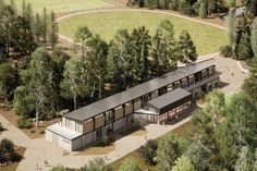 an aerial view of a building surrounded by trees