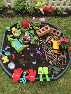 the garden is full of toys and plants