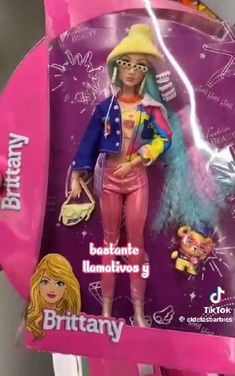 the barbie doll is wearing pink pants and a hat